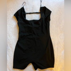 One piece romper. Open back and short sleeve